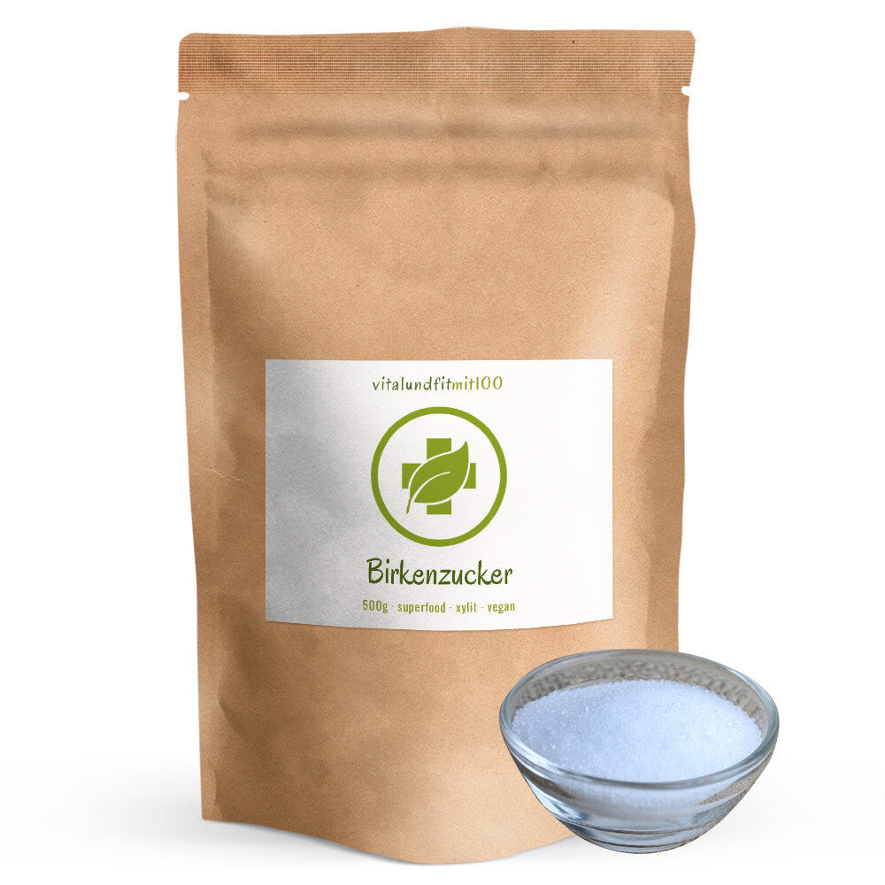 Sachet de 500 g de xylitol de Finlande avec un bol en verre rempli de cristaux blancs de xylitol.